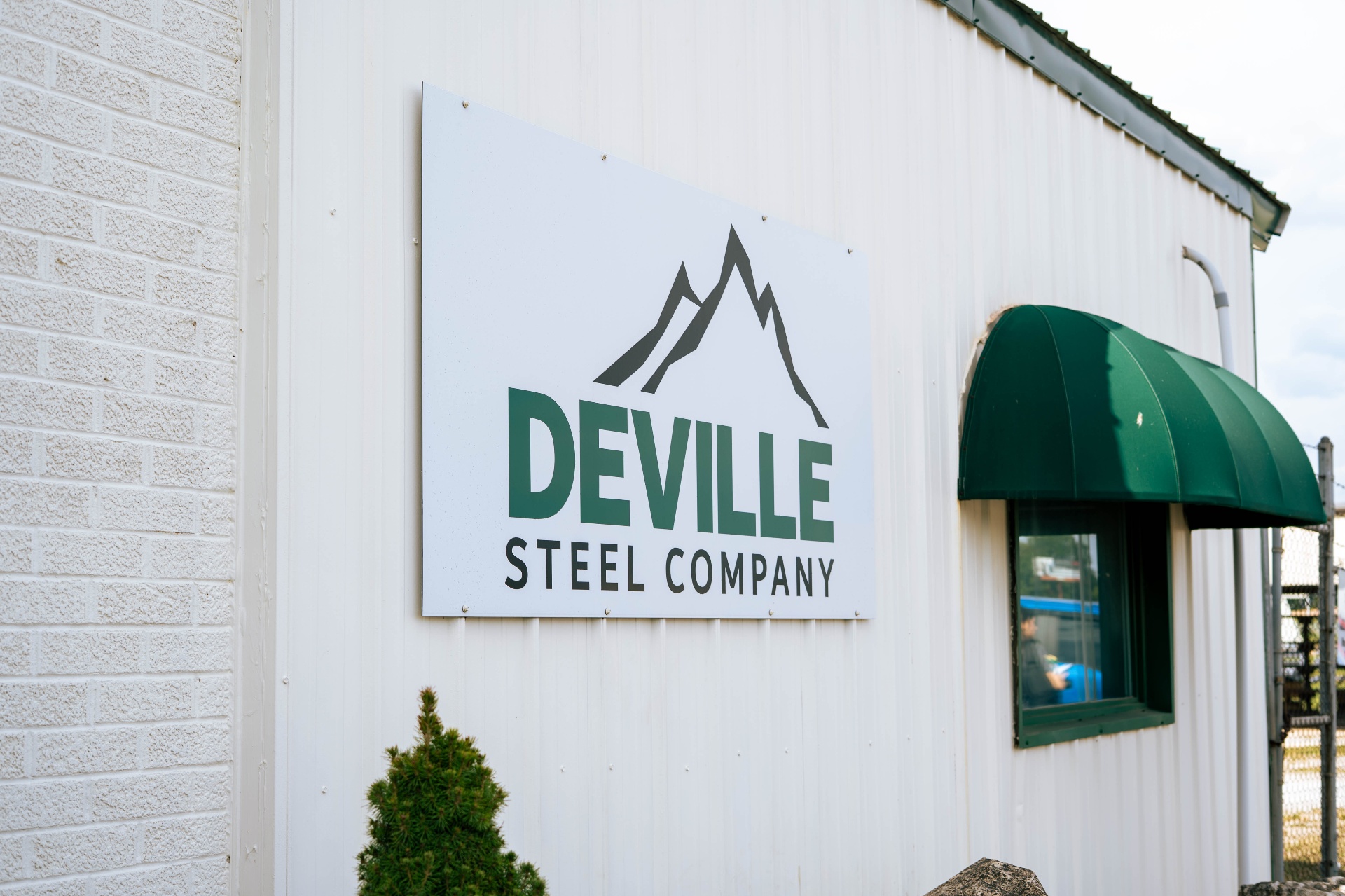 DeVille Steel Company sign on the shop exterior