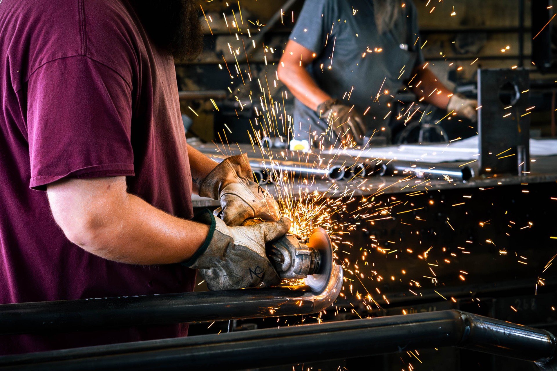 Sparks flying from angle grinder in the DeVille shop